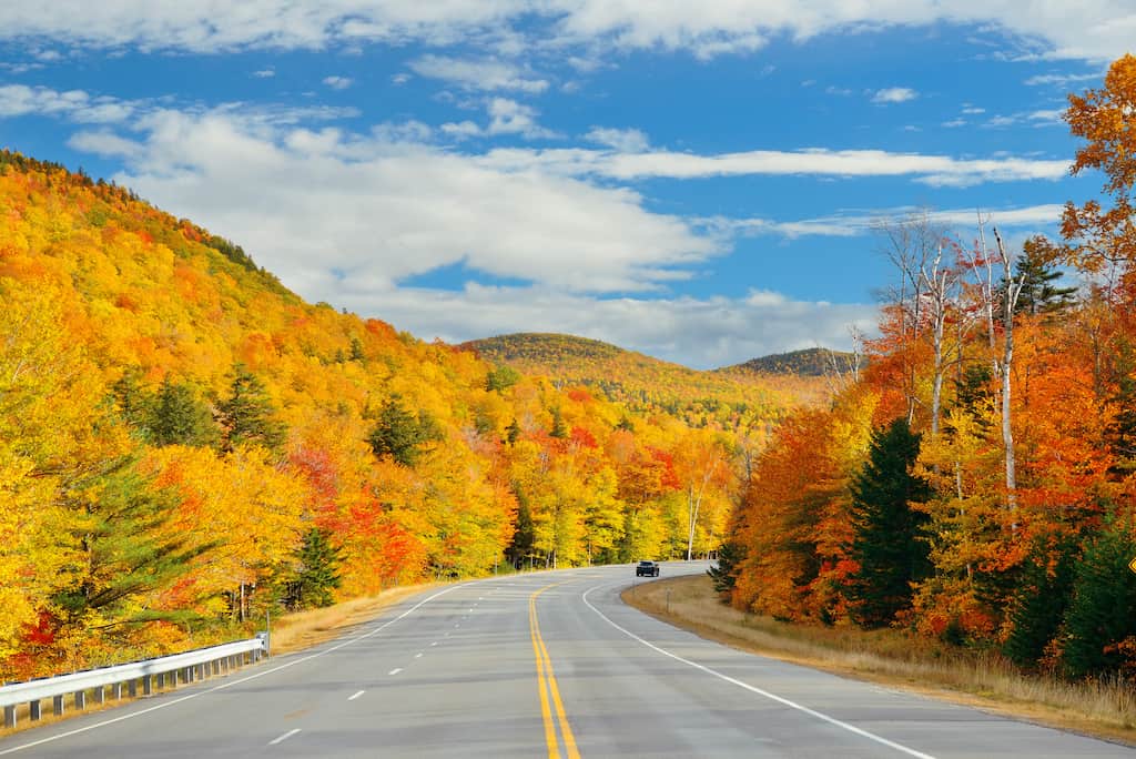 Fall foliage along a stretch of highway in Vermont.