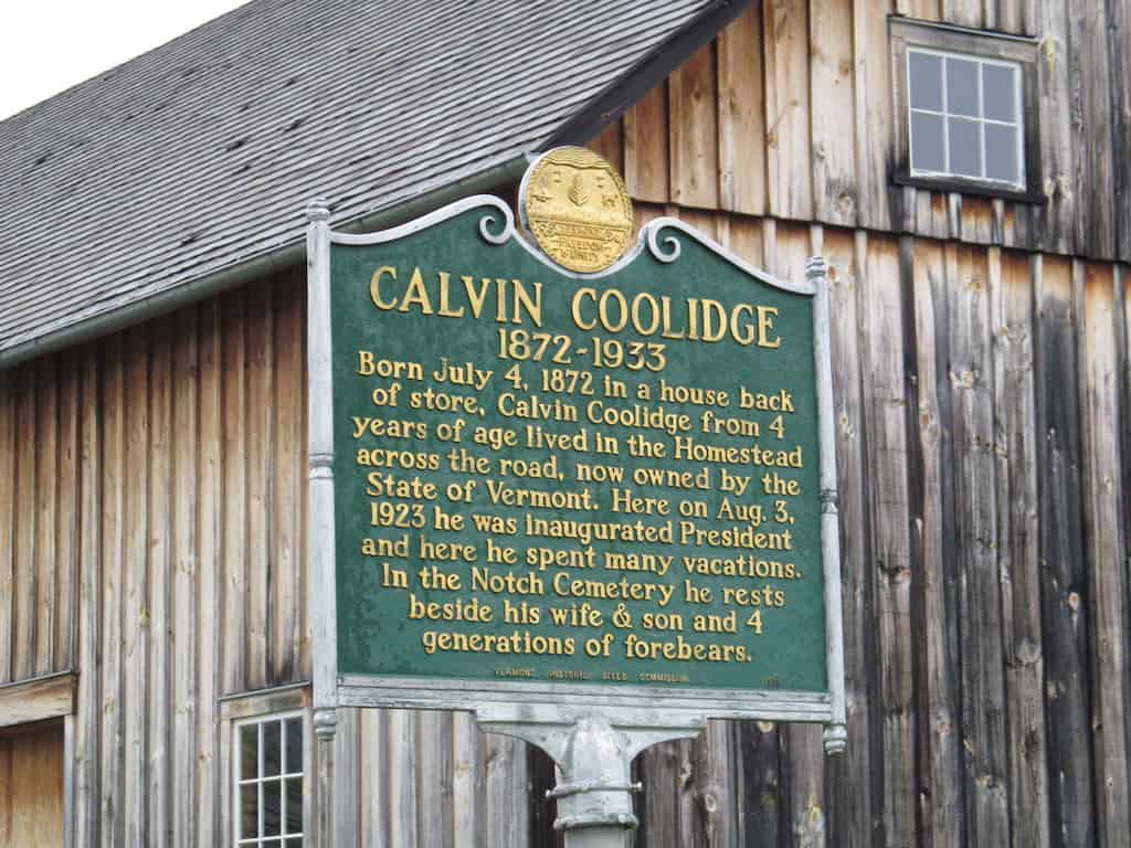 A historical sign in front of the Calvin Coolidge Historic Site in Plymouth Notch, VT.