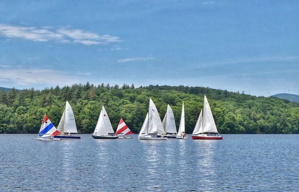 A dozen sailboats congregating on Lake Whitingham in Wilmington, VT