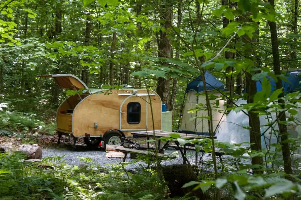 A small teardrop camper in Molly Stark State Park.
