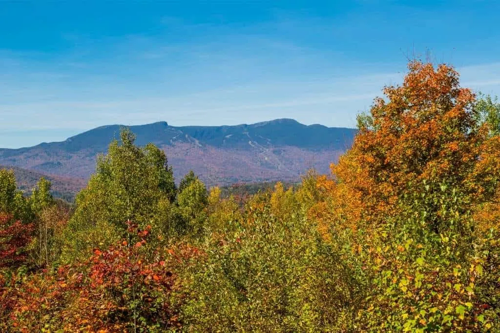 An autumn view of Mt. Mansfield, one of the best places to visit in Vermont in fall.