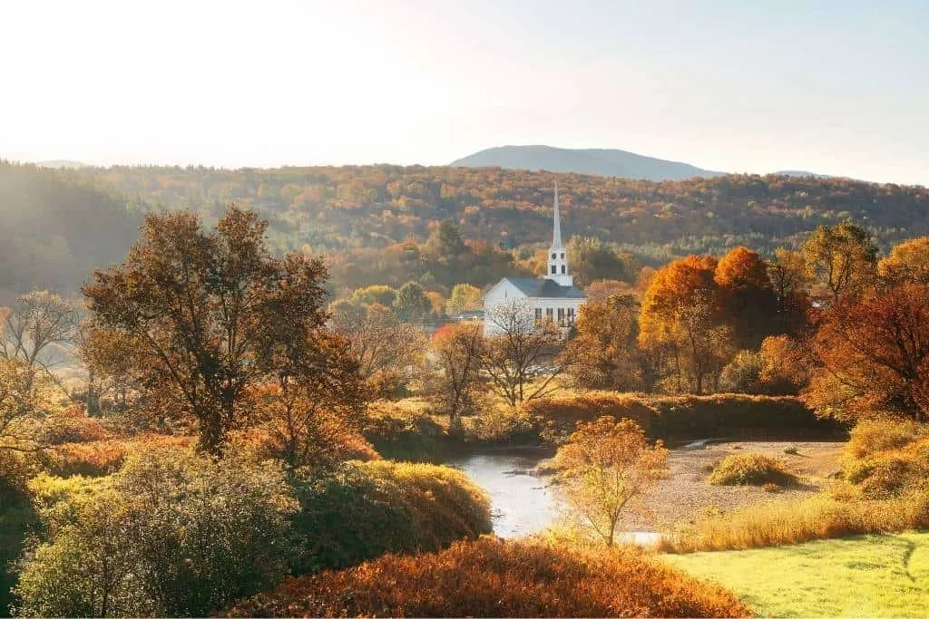 A fall foliage view of Stowe, Vermont on Route 100.