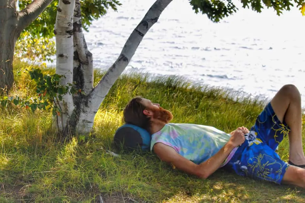 Eric relaxing near the shore at Knight Island State Park in Vermont.