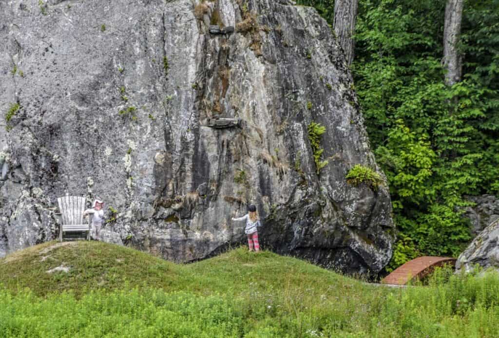 Two children explore around the boulders at Taconic Ramble State Park in Vermont.