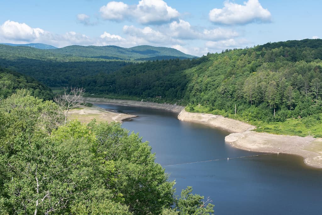 A summer view of Ball Mountain Lake from the top of Ball Mountain Dam near Jamaica State Park in Vermont