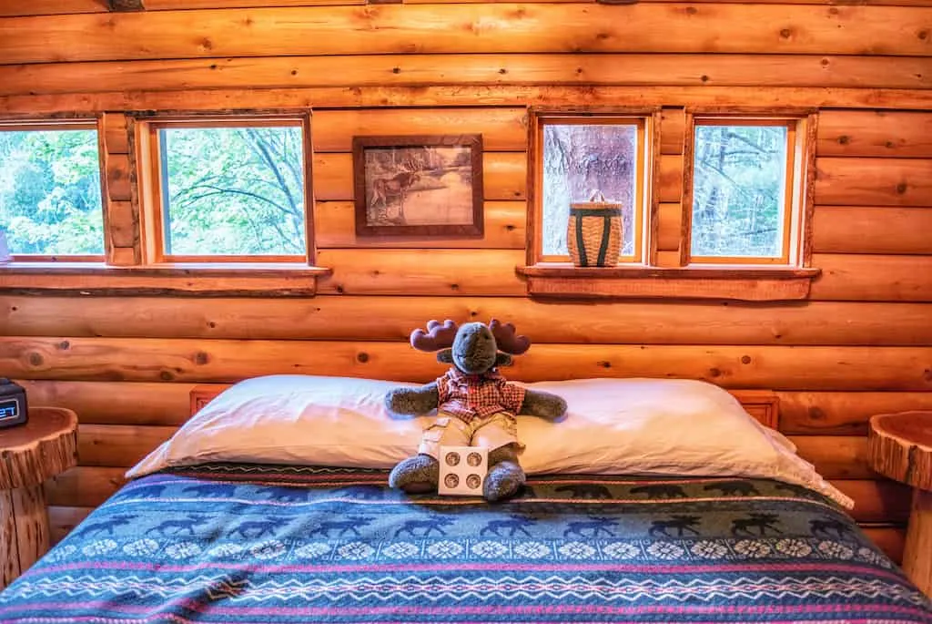 The queen-size bed in Moose Meadow Treehouse in Waterbury, Vermont.