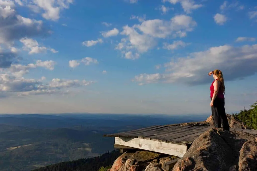 A hiker checks out the view from the hang gliding platform on the top of Mt. Ascutney in Vermont.