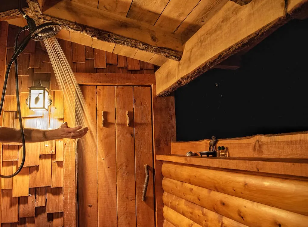 The outdoor shower at the Moose Meadow Lodge Treehouse rental in Vermont.