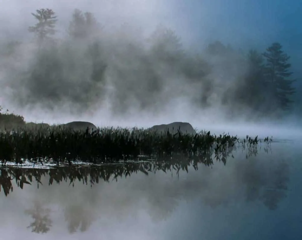 A foggy morning view of Ricker Pond in Groton State Forest, Vermont.