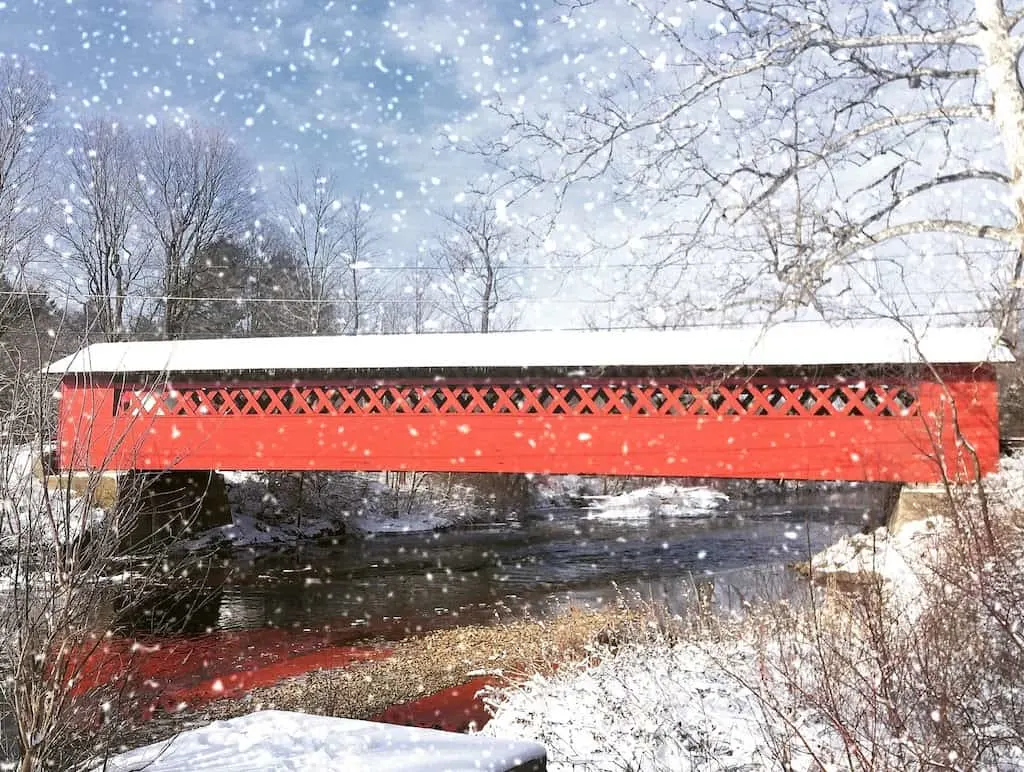 The Burt Henry Covered Bridge in Bennington, Vermont during a snowstorm.