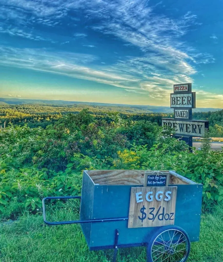 A sign advertising eggs for $3, plus beer and pizza at the top of Hogback Mountain in Wilmington, Vermont.