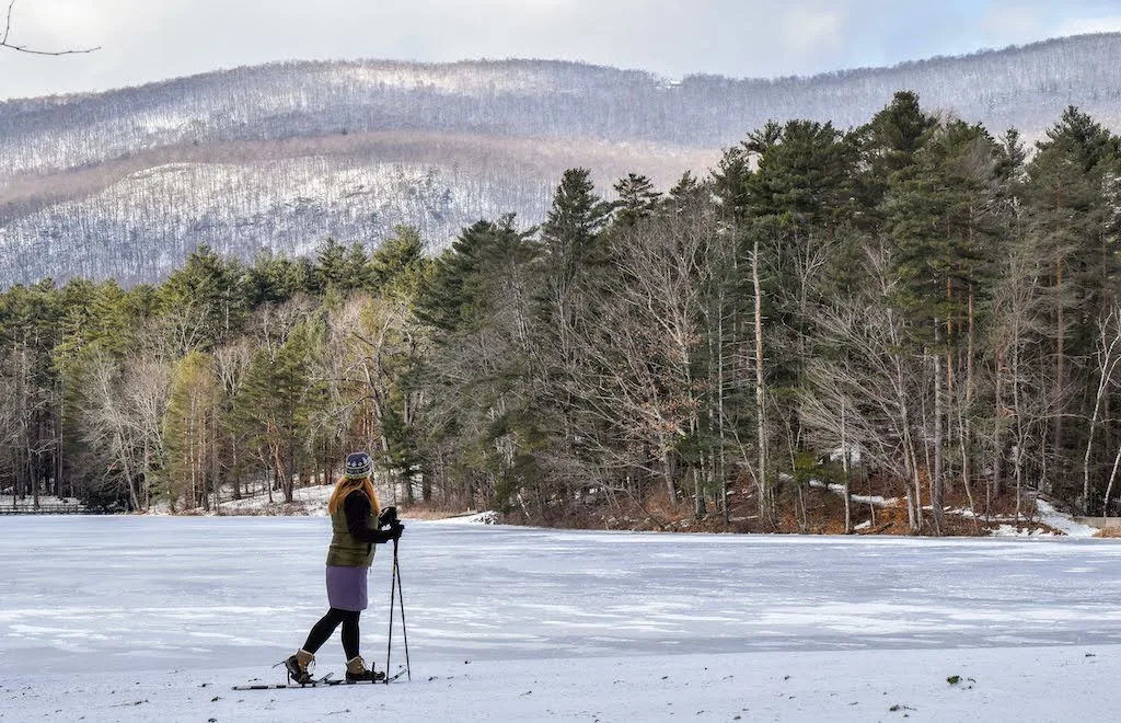 Snowshoeing across frozen Lake Shaftsbury in Vermont.