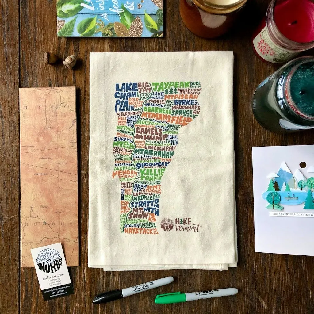 A tea towel printed with the names of Vermont's most hiked mountains. 