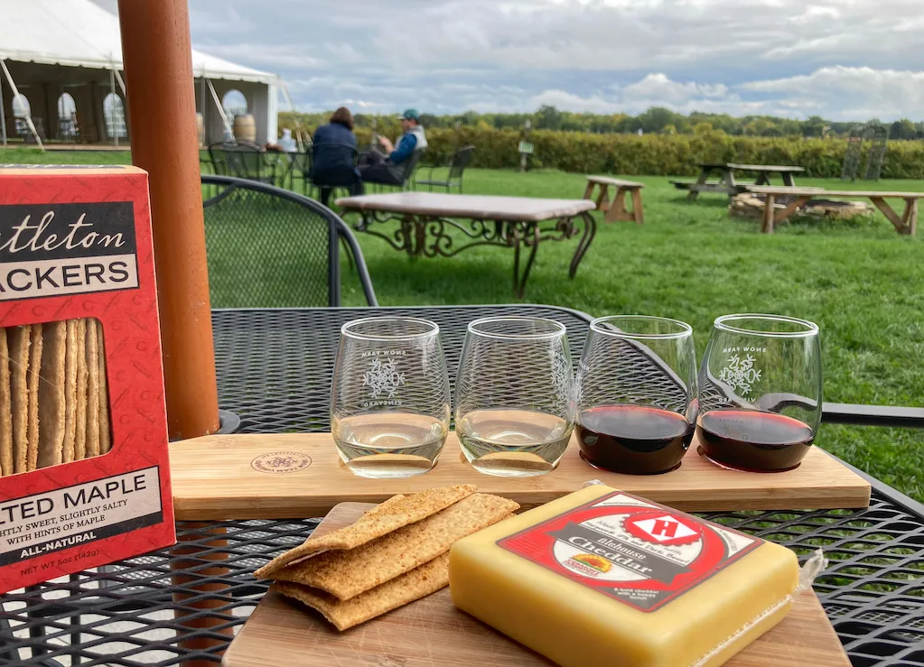 A flight of wine at Snow Farm Vineyard and Winery with Vermont cheese and crackers and a lovely view.