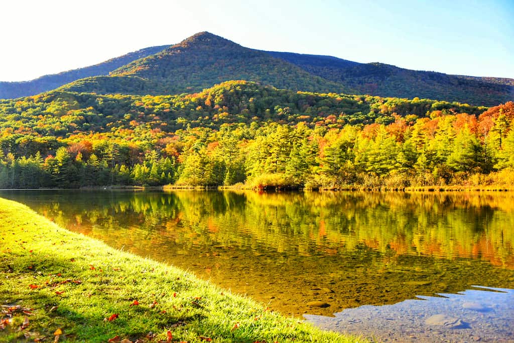 A Vermont fall foliage view of Equinox Pond in Manchester, Vermont.