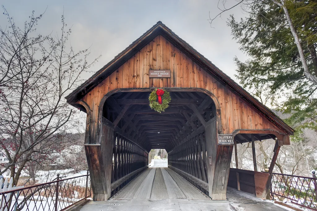 A covered bridge in downtown Woodstock, Vermont, one of the best Vermont winter getaways.