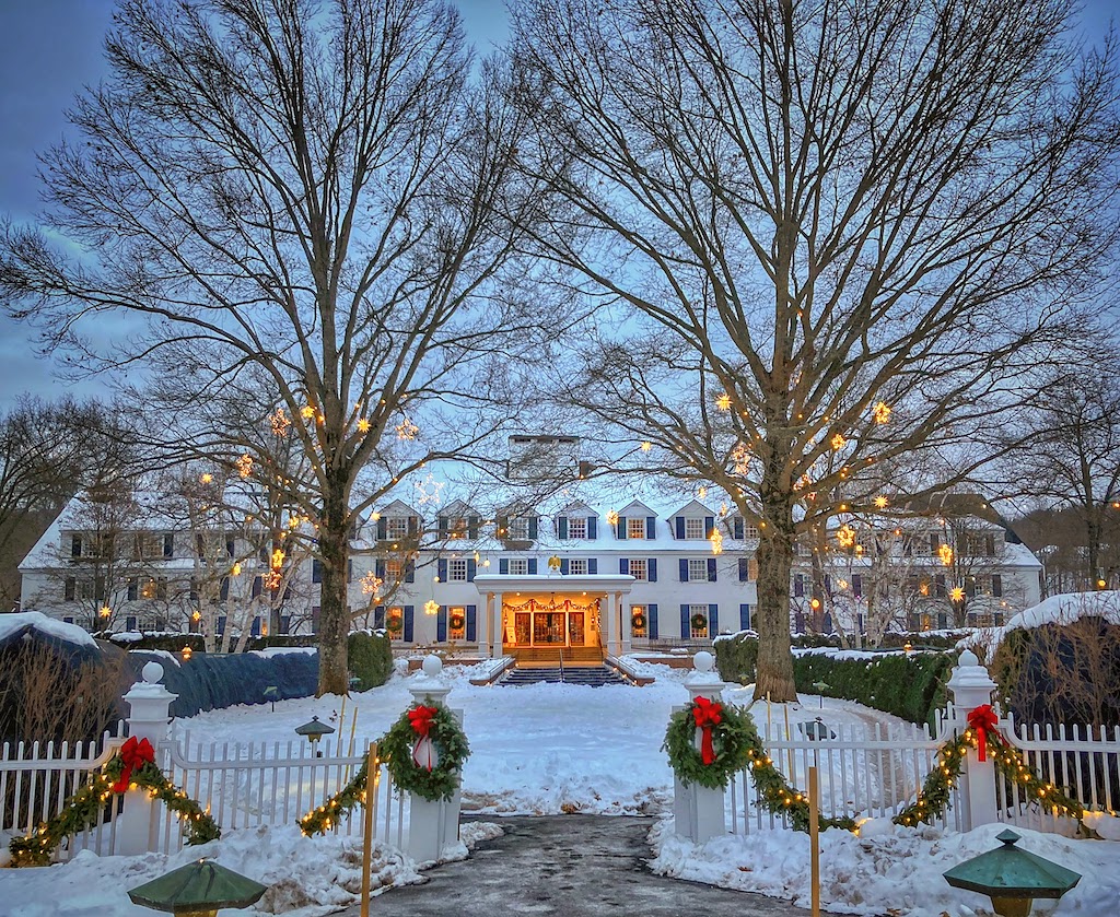The iconic Woodstock Inn & Resort with holiday decorations in winter.
