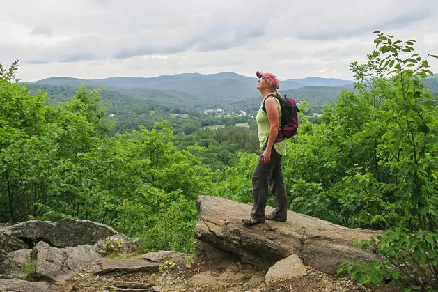 The author scoping out the view from the top of Mount Tom's South Peak in Woodstock, Vermont.