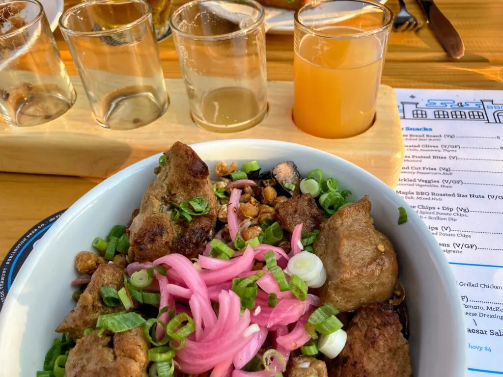 A flight of beers and a plate of salad at Burlington Beer Company in Vermont. 