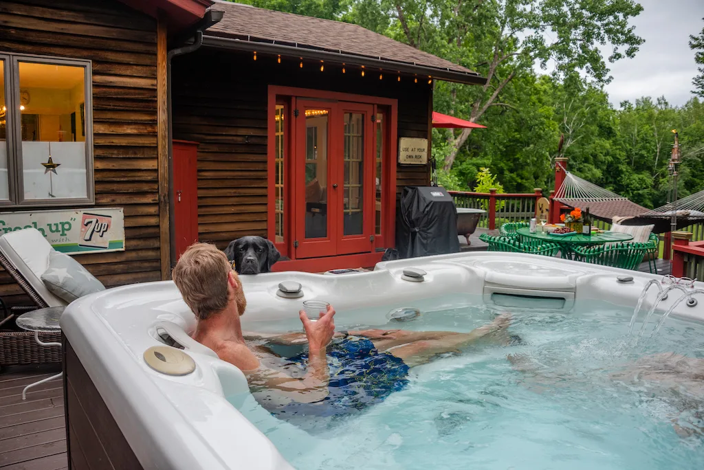 Eric relaxing in the hot tub at Velvet Antlers Cottage in Shaftsbury, Vermont. 