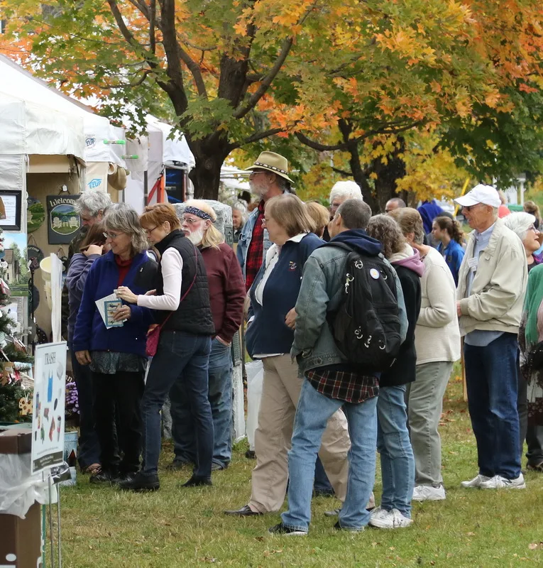 A group of people gathers at the Newfane Harvest Festival in Vermont.