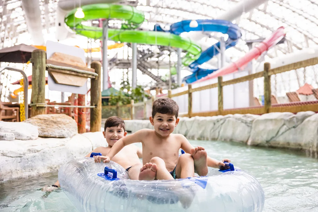 Two kids enjoy Big River at Jay Peak as one of several Vermont Experience Gifts for the holidays.