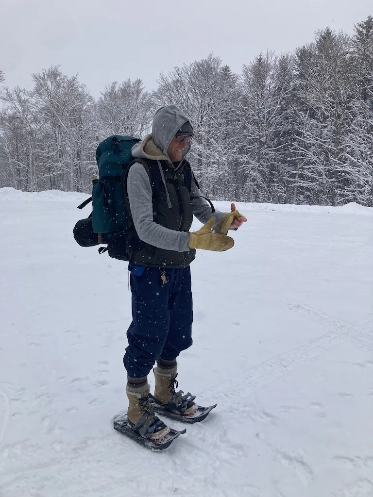 Eric in the snow dressed in winter clothing.