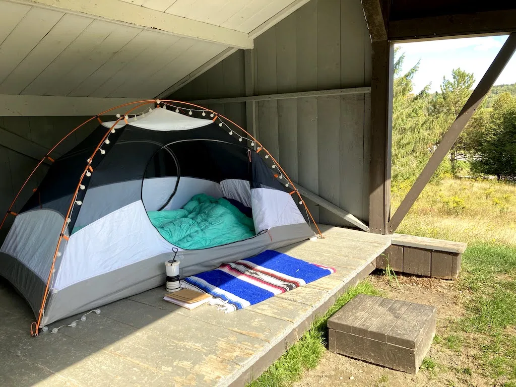 A small tent inside a lean-to at Elmore Lake State Park. 