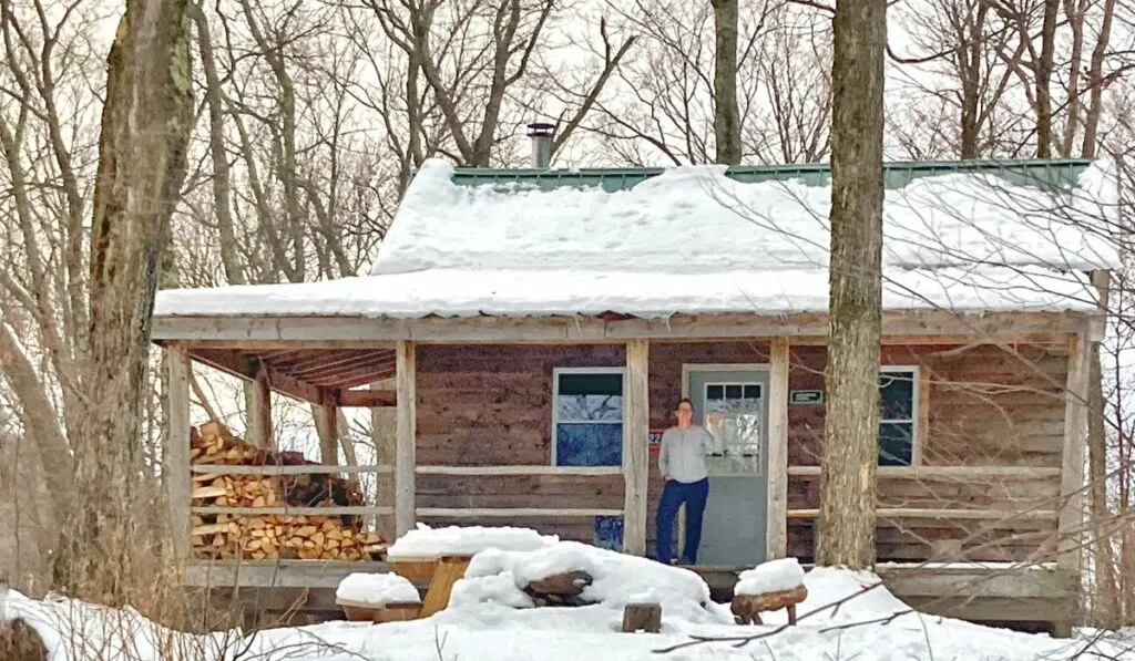 A remote Vermont cabin covered with snow.