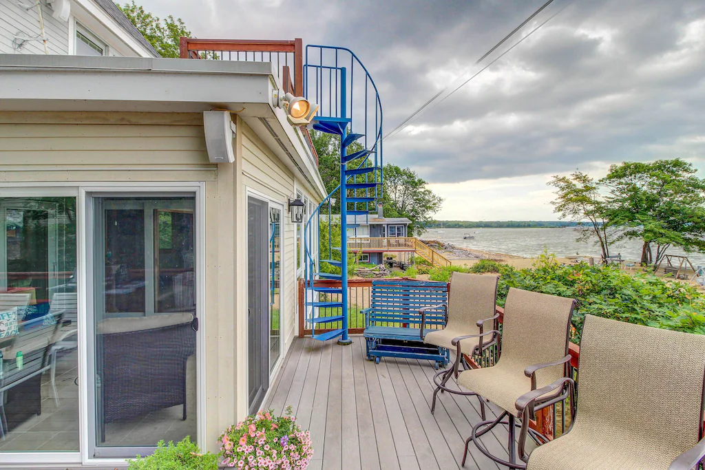 A sprawling waterfront deck with chairs on Lake Champlain near Burlington.