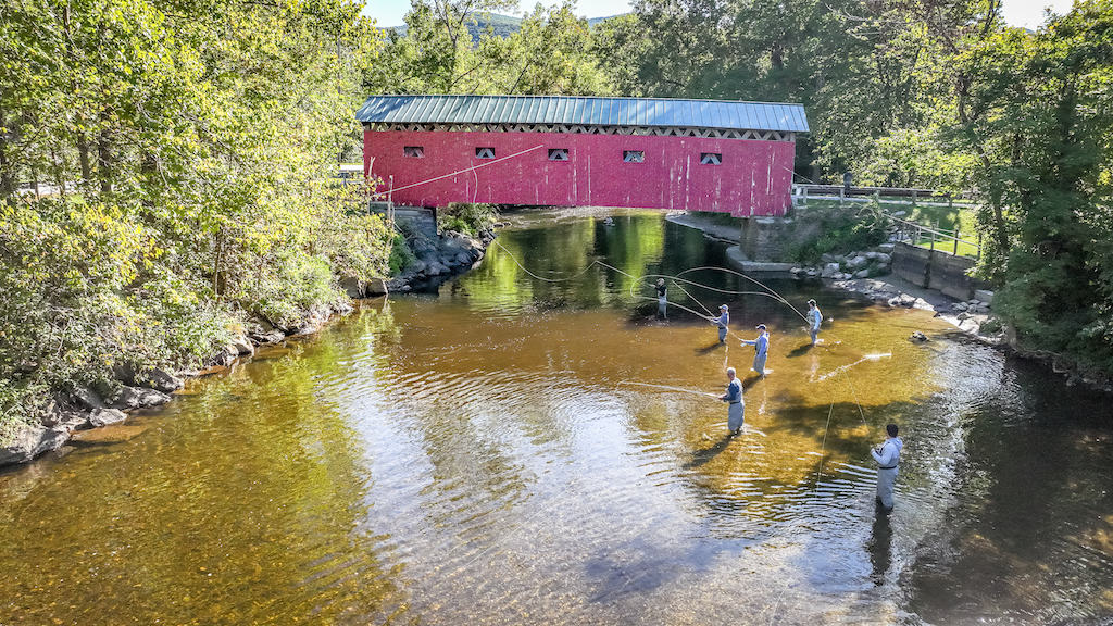 Fly fishing under a covered bridge in Vermont.