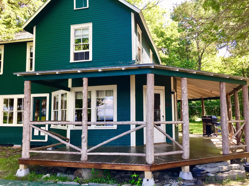 Large Adirondack-style home in the woods of Vermont.