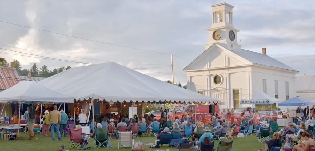 a crowd of people listening to music at the Cabot Arts and Music Festival in Cabot, Vermont.