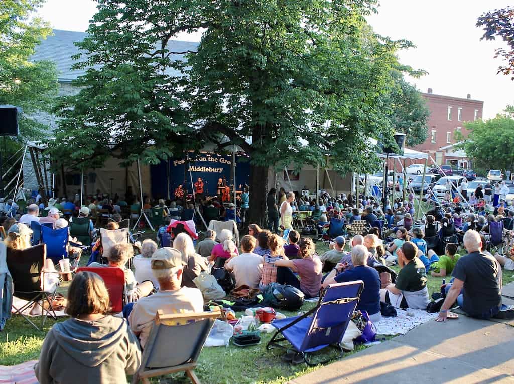 A crowd of people gather at Festival on the Green in Middlebury, Vermont.