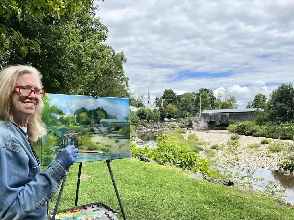 Candy Barr pants in watercolor next to a covered bridge in the Mad River Valley of Vermont.