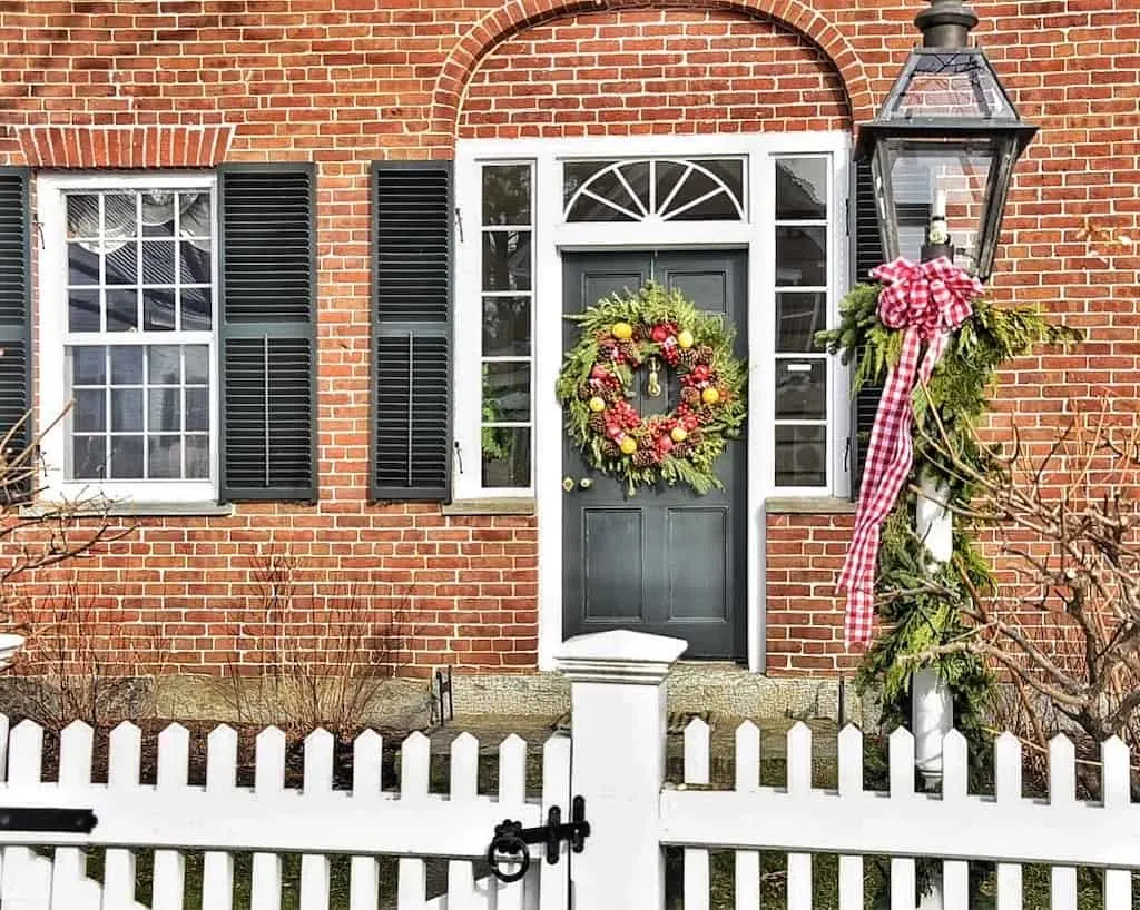 A brick home decorated for Christmas in Grafton, Vermont.