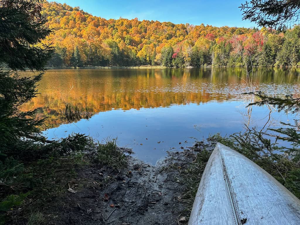 Fall foliage reflected in Pleiad Lake. 