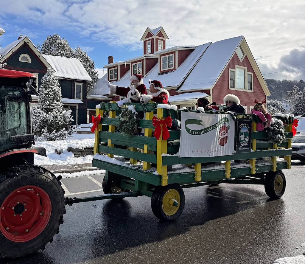Santa rides through Stowe in a wagon pulled by a tractor. Photo by Teresa Merelman