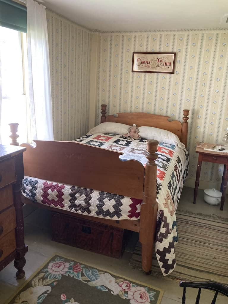 A quilt on a bed in the Calvin Coolidge homestead.