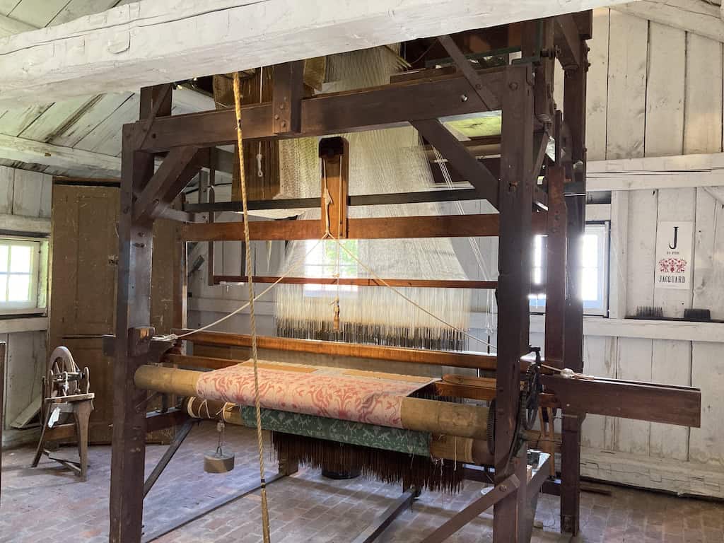 A massive, antique loom on display at the Shelburne Museum.