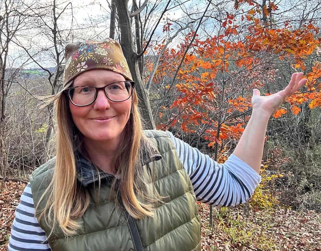 Tara wearing a cozy hat and a down vest.